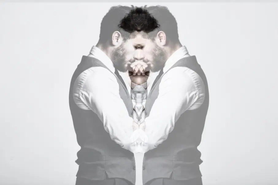 Man with a distressed expression, symbolizing projective personality disorder. Learn about the complications of projective personality disorder, where individuals project their own emotions onto others, leading to relational challenges.